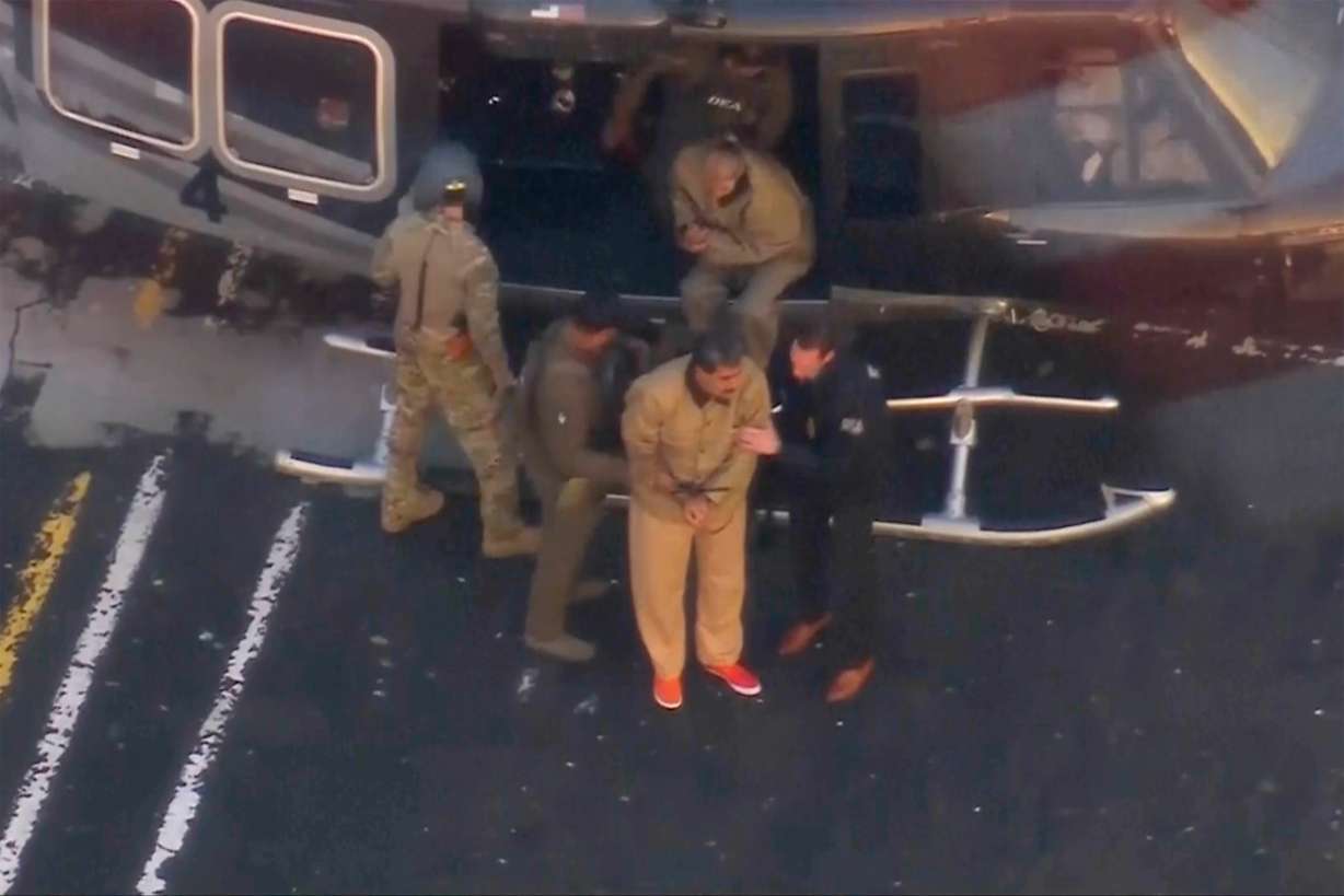 This image taken video shows Venezuelan President Nicolas Maduro getting off a helicopter on his way to Manhattan Federal Court, Monday, in New York.