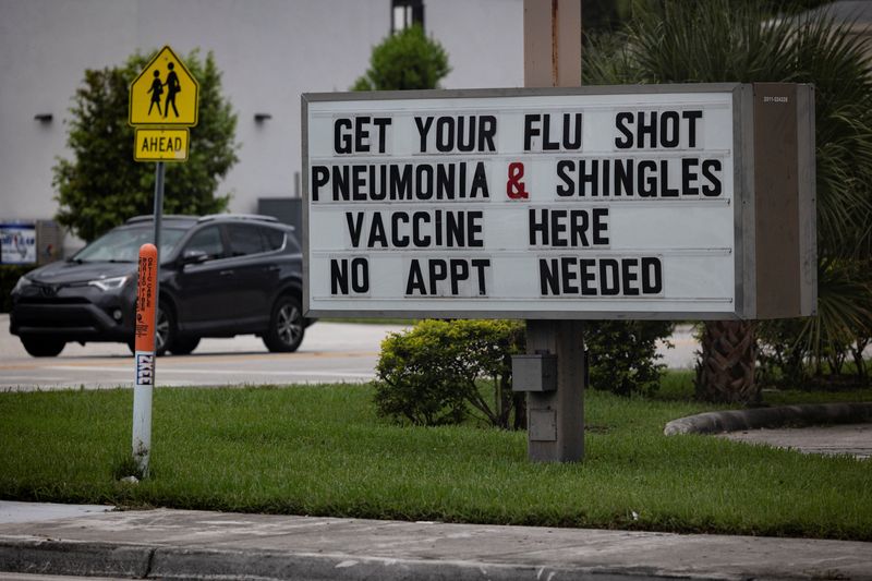 A sign advertises flu, pneumonia and shingles vaccines at a Walgreens pharmacy in Miami, Florida, on Sept. 4, 2025.