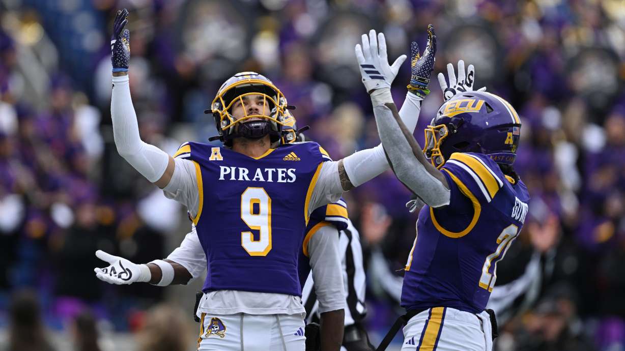 East Carolina wide receiver Anthony Smith (9) reacts after scoring a touchdown against Pittsburgh during the second half of the Military Bowl NCAA college football game, Saturday, Dec. 27, 2025, in Annapolis, Md.