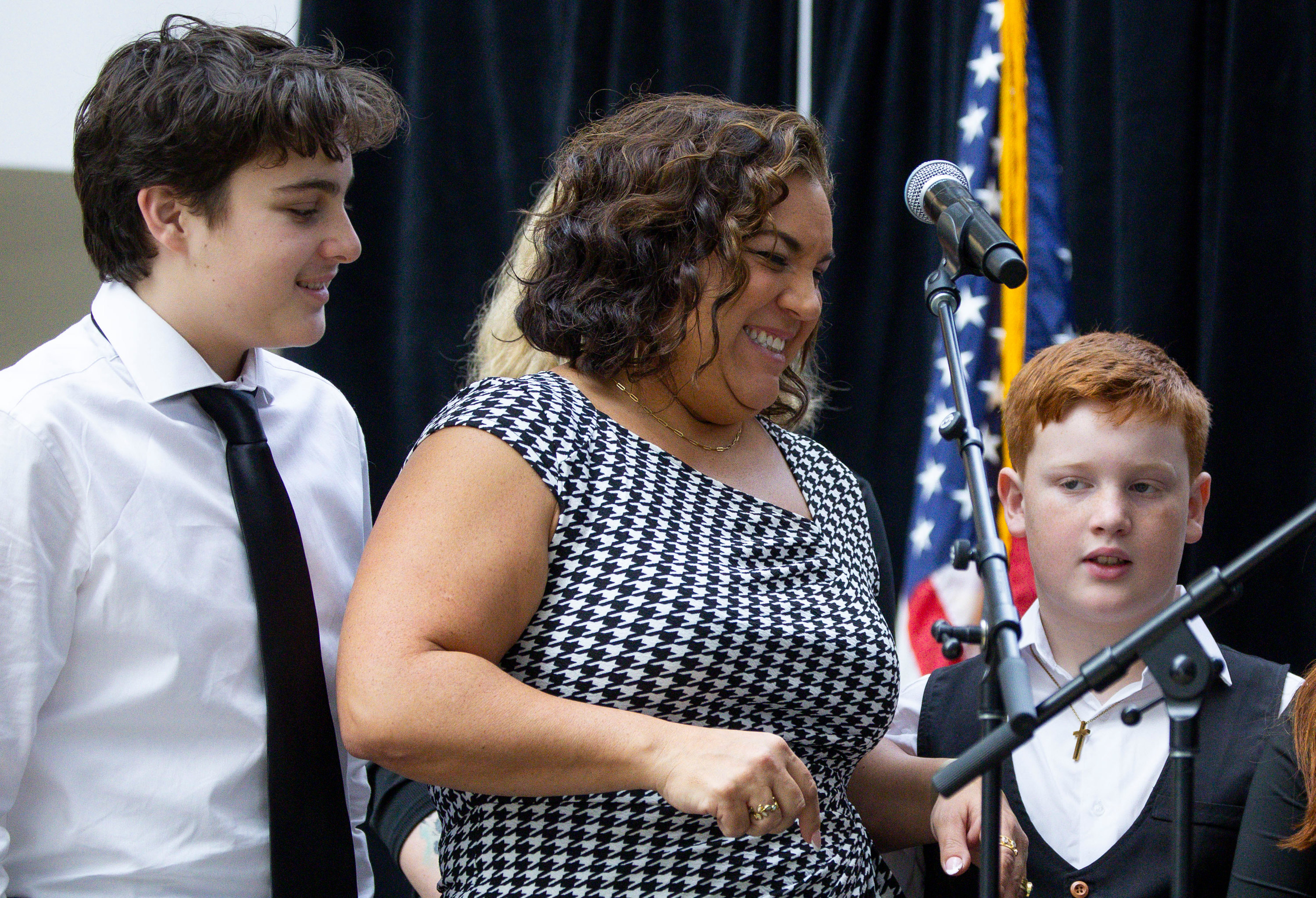 Salt Lake City Council District 1 representative Victoria Petro, center, laughs while preparing to take the oath of office during an inauguration event at the Salt Lake City Public Library in Salt Lake City on Monday.