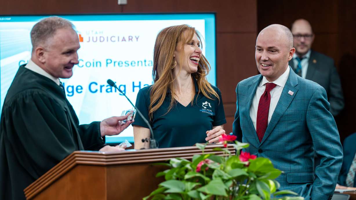 Second District Court Judge Craig Hall, Jennie Taylor and Utah Gov. Spencer J. Cox at a ceremony to launch a new Veterans Treatment Court initiative in the 2nd District Court in Ogden on Monday.