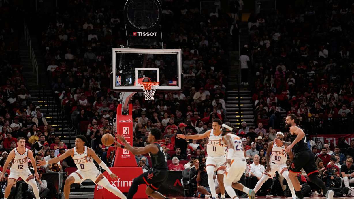 Play continues with the shot clock not working during the first half of an NBA basketball game between the Phoenix Suns and Houston Rockets Monday, Jan. 5, 2026, in Houston.