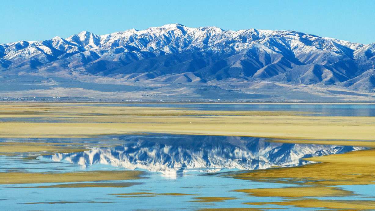 The Stansbury Mountains are reflected in a patch of water along the Great Salt Lake on Jan. 6.
