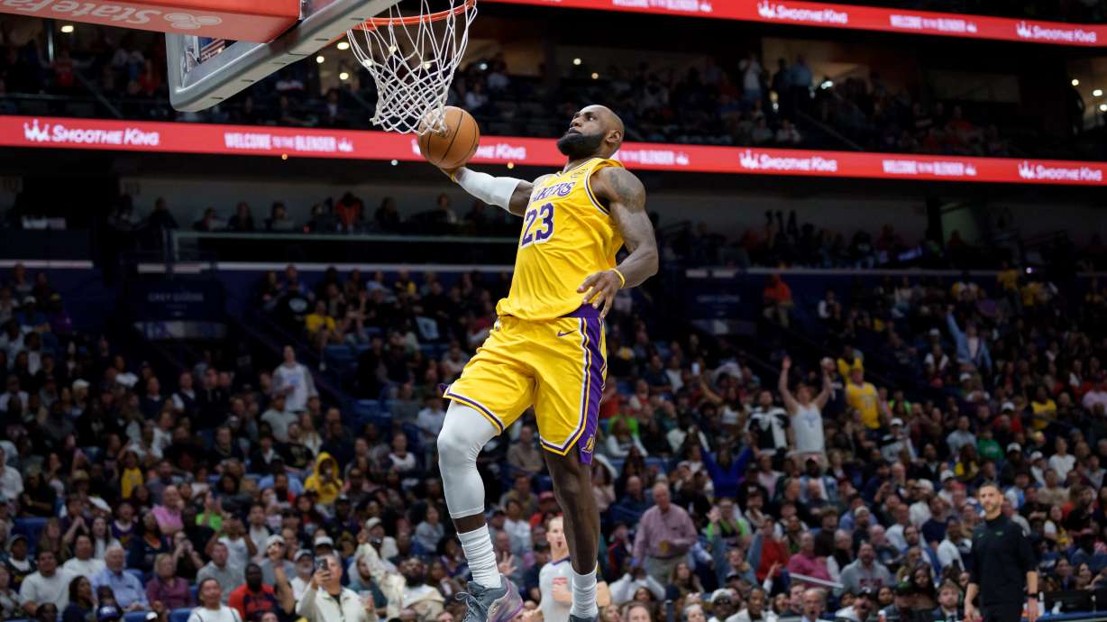 Los Angeles Lakers forward LeBron James (23) breaks free for a dunk against the New Orleans Pelicans during the second half of an NBA basketball game in New Orleans, Tuesday, Jan. 6, 2026.
