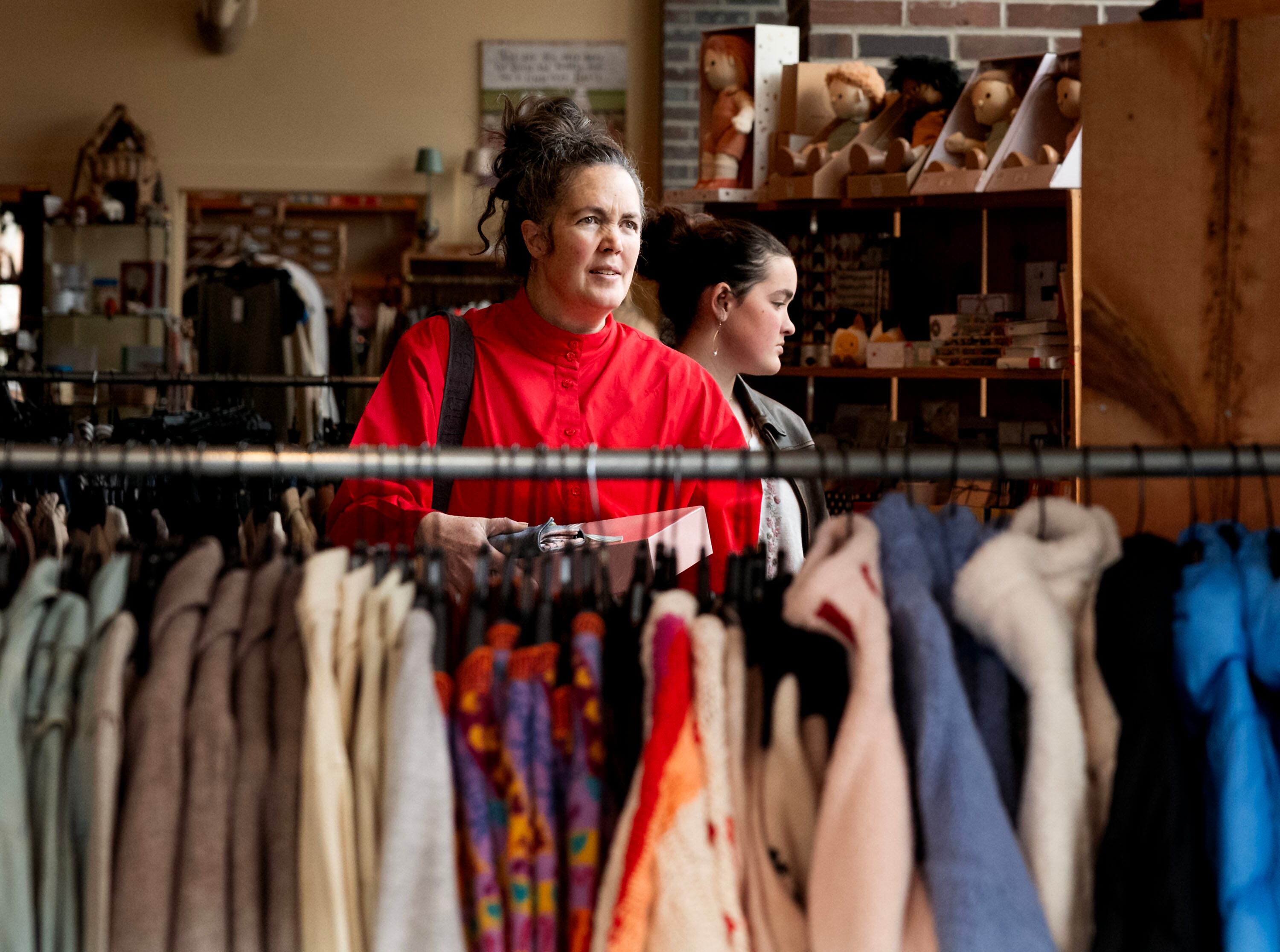 Kara Olsen and her daughter, Sabrina, shop at The Children’s Hour in the 9th and 9th shopping district of Salt Lake City on Dec. 24, 2025.
