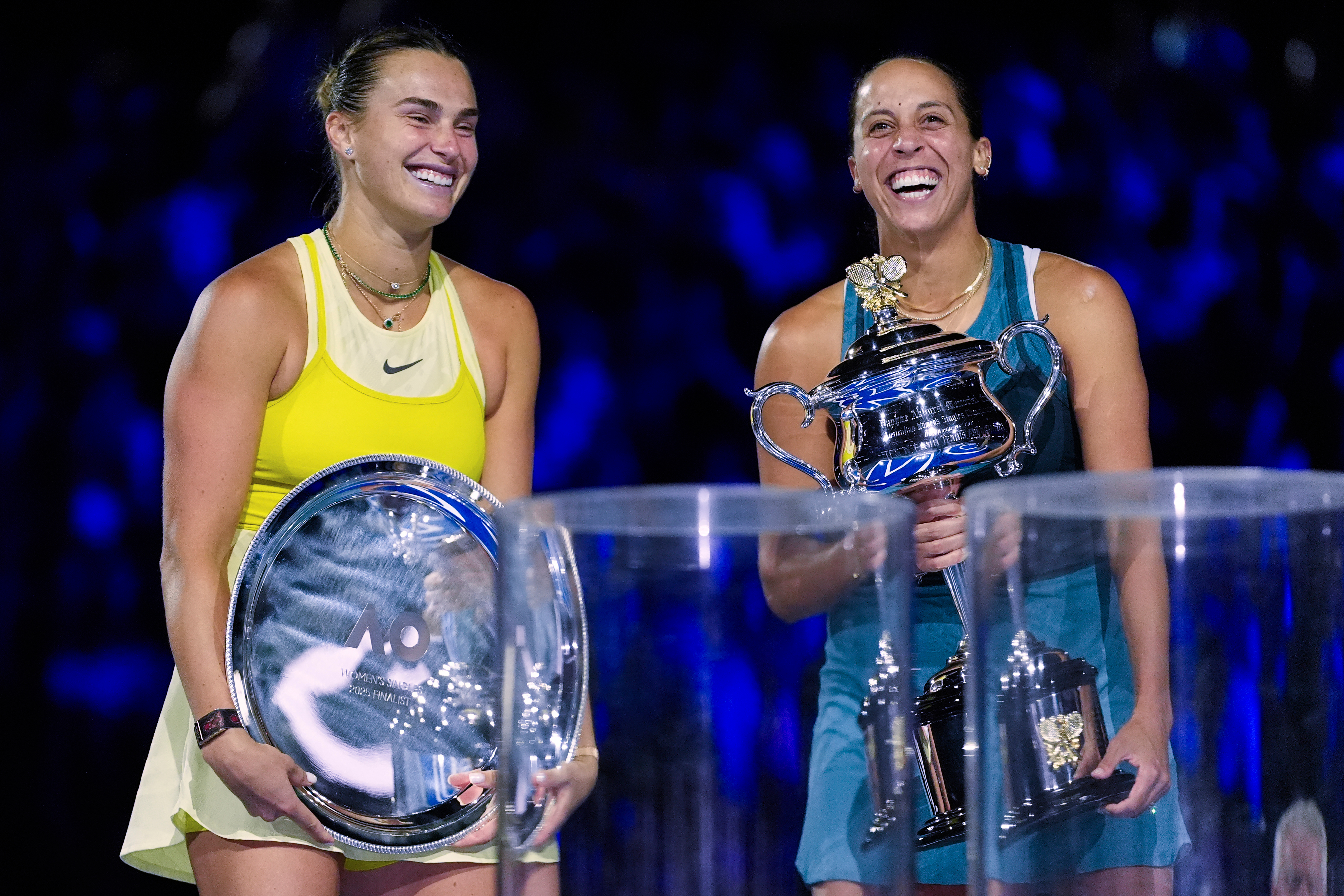 FILE -Madison Keys, right, of the U.S. reacts as she holds the Daphne Akhurst Memorial Cup after defeating Aryna Sabalenka, left, of Belarus in the women's singles final at the Australian Open tennis championship in Melbourne, Australia, Jan. 25, 2025.