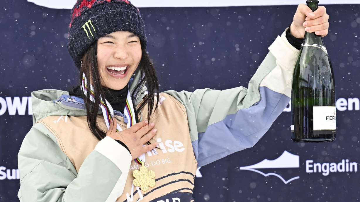 FILE - Gold medalist Chloe Kim of USA reacts on the podium after the Women's Snowboard Halfpipe competition at the FIS Snowboard, Freestyle and Freeski World Championships in St. Moritz, Switzerland, Saturday, March 29, 2025.