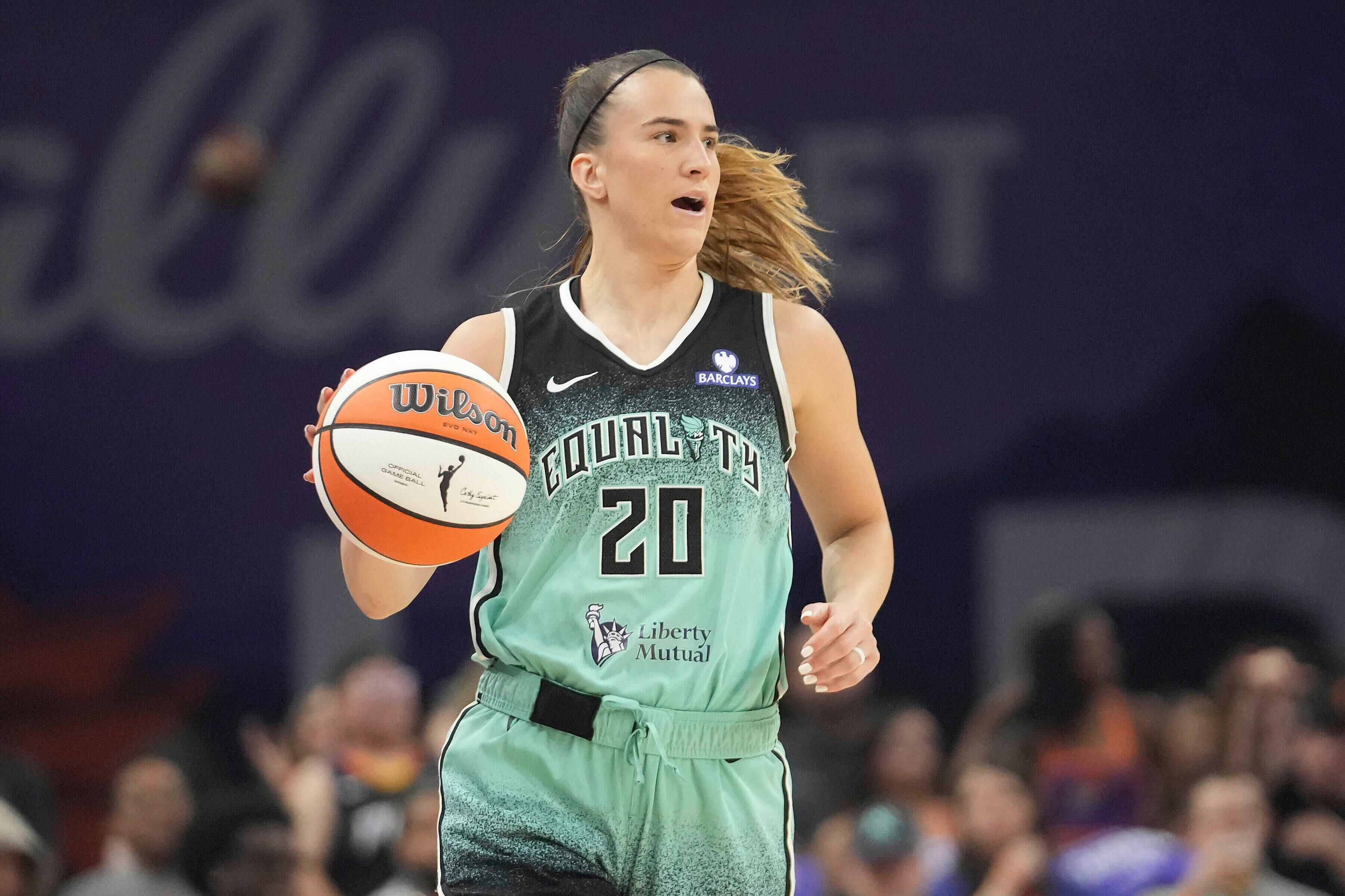FILE - New York Liberty guard Sabrina Ionescu controls the ball against the Phoenix Mercury during the second half of Game 1 during the first round of the WNBA basketball playoffs Sept. 14, 2025, in Phoenix.