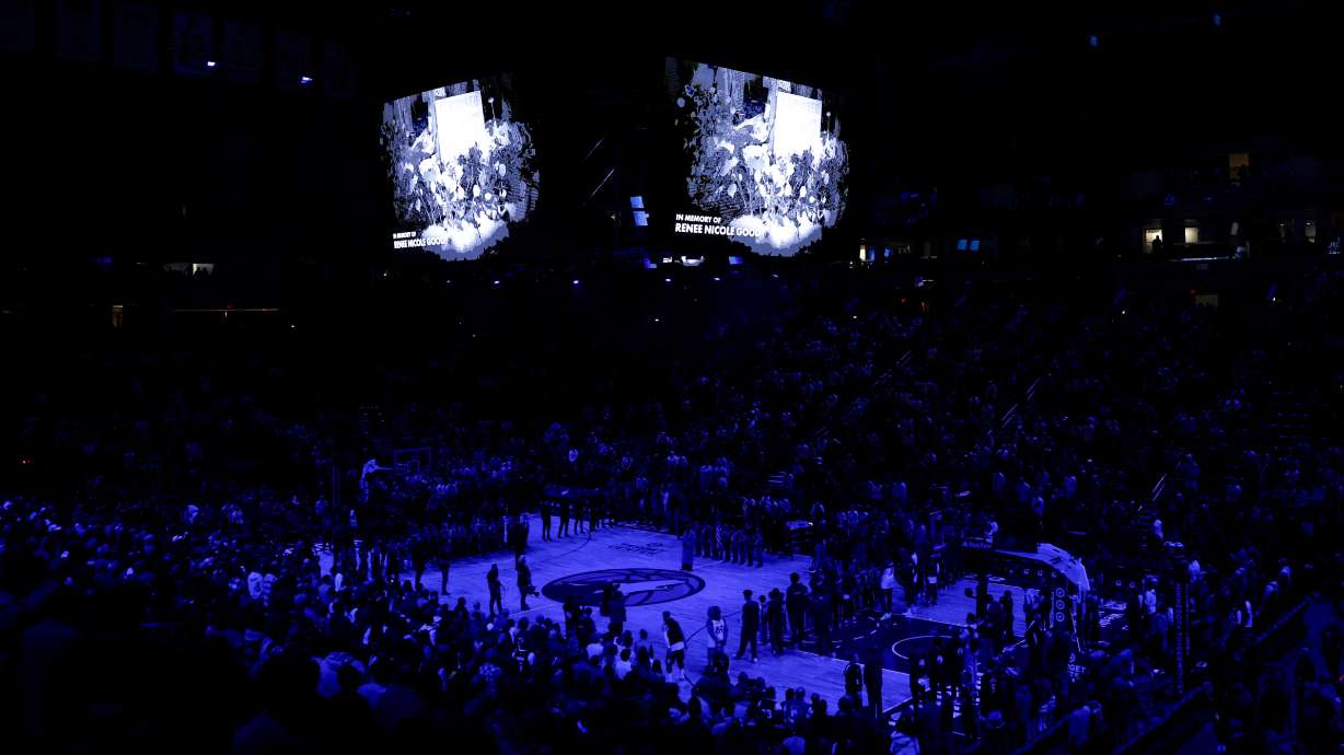 Minnesota Timberwolves and Cleveland Cavaliers players take part in a moment of silence for Renee Good, who was fatally shot by an ICE officer yesterday in Minneapolis, before an NBA basketball game, Thursday, Jan. 8, 2026, in Minneapolis.