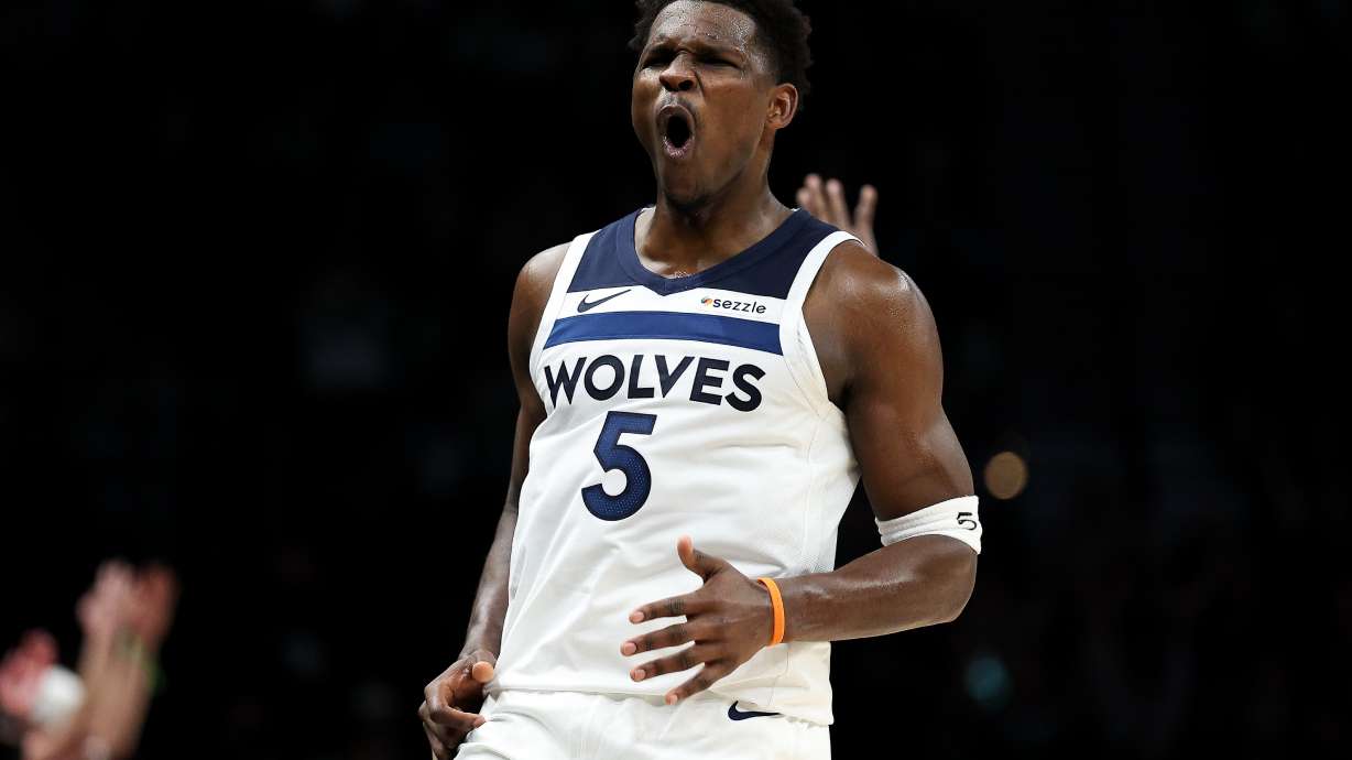 Minnesota Timberwolves guard Anthony Edwards (5) celebrates his three-point basket during the second half of an NBA basketball game against the Cleveland Cavaliers, Thursday, Jan. 8, 2026, in Minneapolis.