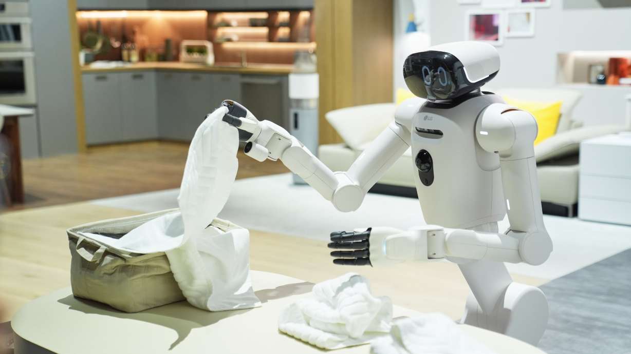 An LG CLOiD robot folds laundry at the LG Electronics booth during the CES tech show Tuesday, in Las Vegas. It was just one of several innovations on display at the show.
