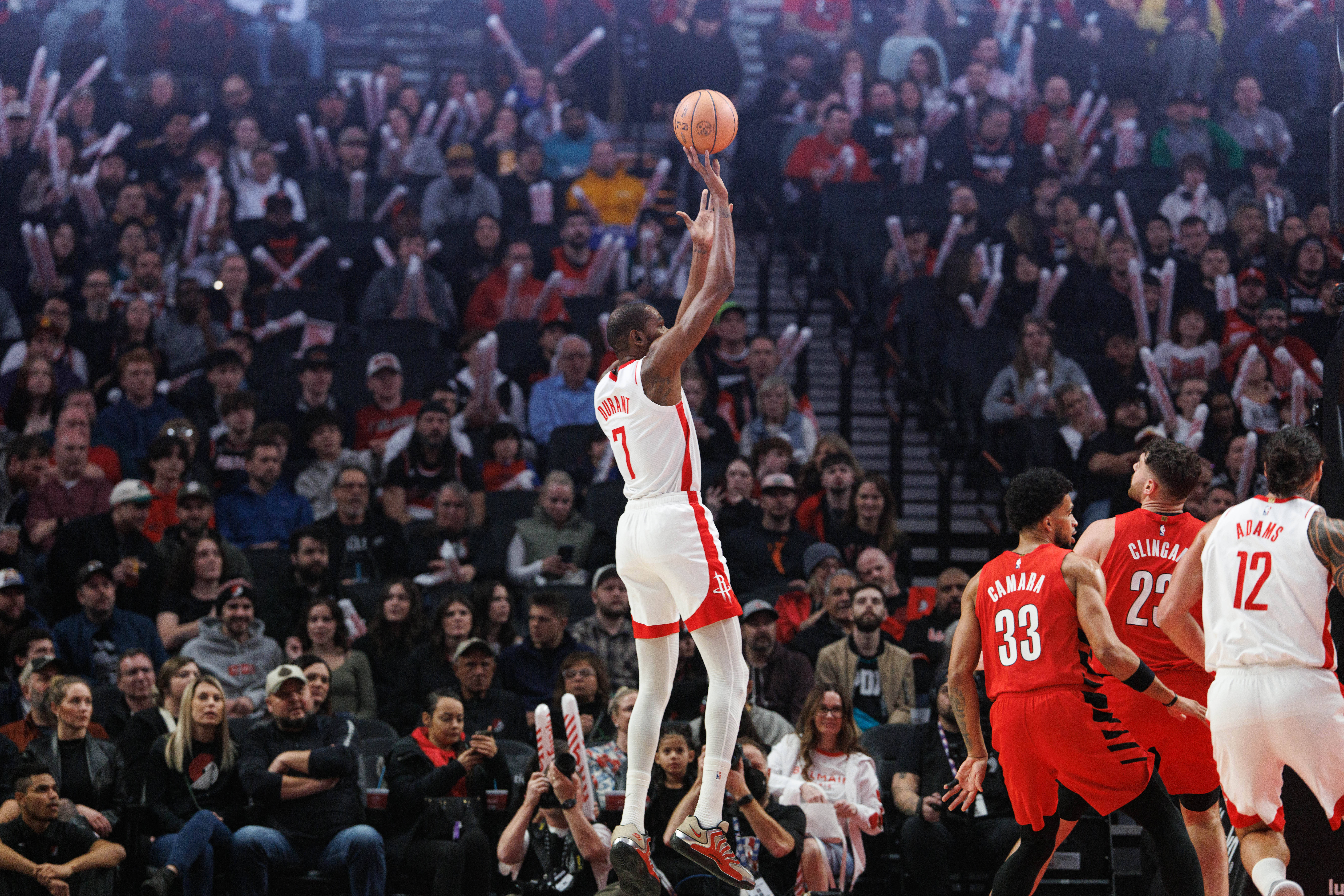 Houston Rockets forward Kevin Durant, center, shoots against the Portland Trail Blazers during the first half of an NBA basketball game Friday, Jan. 9, 2026, in Portland, Ore.