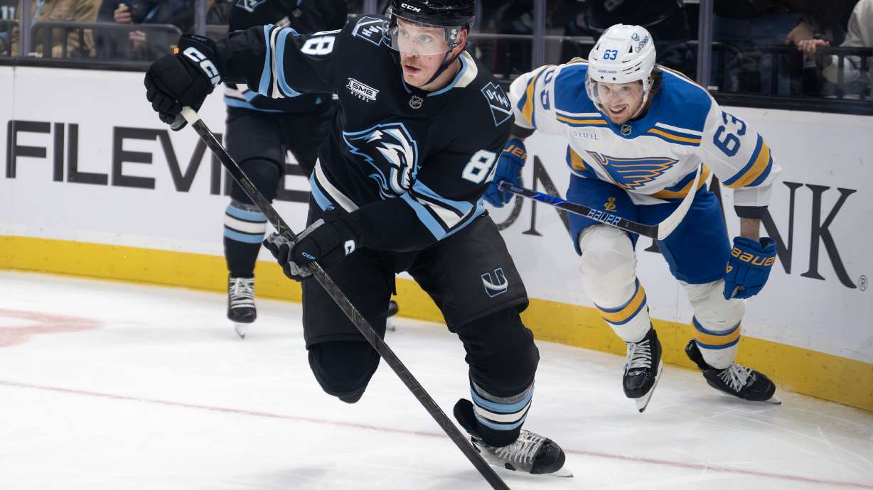 Utah Mammoth defenseman Nate Schmidt (88) looks down ice as he tries to clear the puck as the Mammoth and St. Louis Blues play at the Delta Center in Salt Lake City on Friday, Jan. 9, 2026.