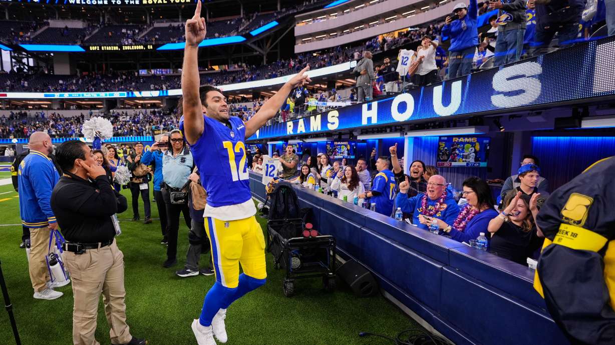 Los Angeles Rams wide receiver Puka Nacua (12) celebrates with fans as he exits the field following the team's victory over the Arizona Cardinals in an NFL football game, Sunday, Jan. 4, 2026, in Inglewood, Calif.