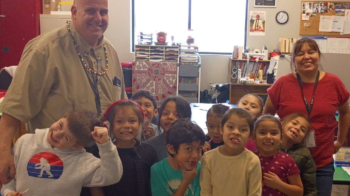 Chief Tahgee Elementary Academy’s kindergarten class poses with Principal David Mirhadi and teacher Lorinda Sowell. This group will be the first class to spend its entire K–7 education in the school’s new, permanent building.