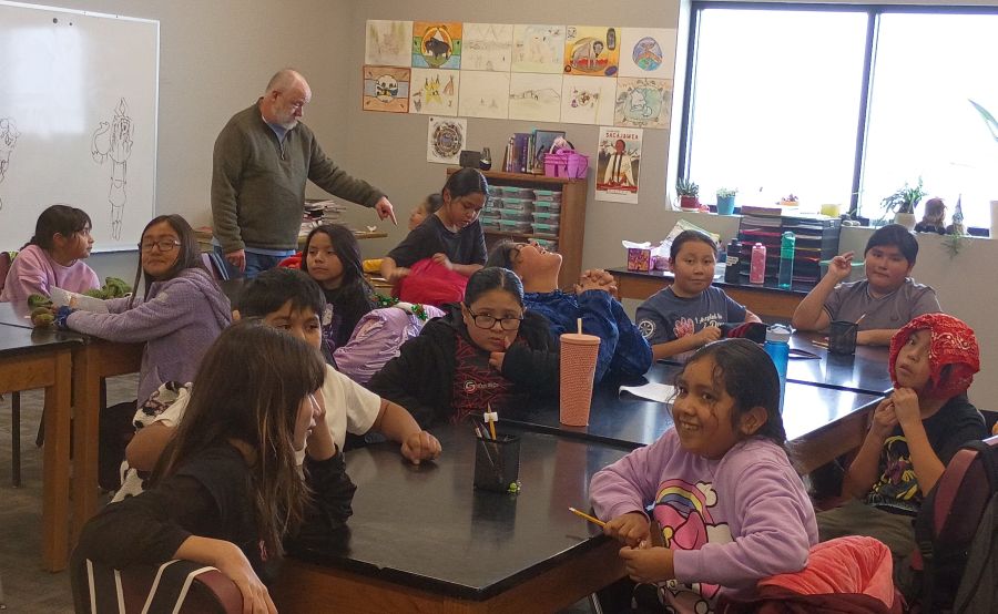 Fourth-grade students learn in their new classroom at Chief Tahgee Elementary Academy with teacher Lloyd Jonah as the school begins a new chapter in its permanent facility.
