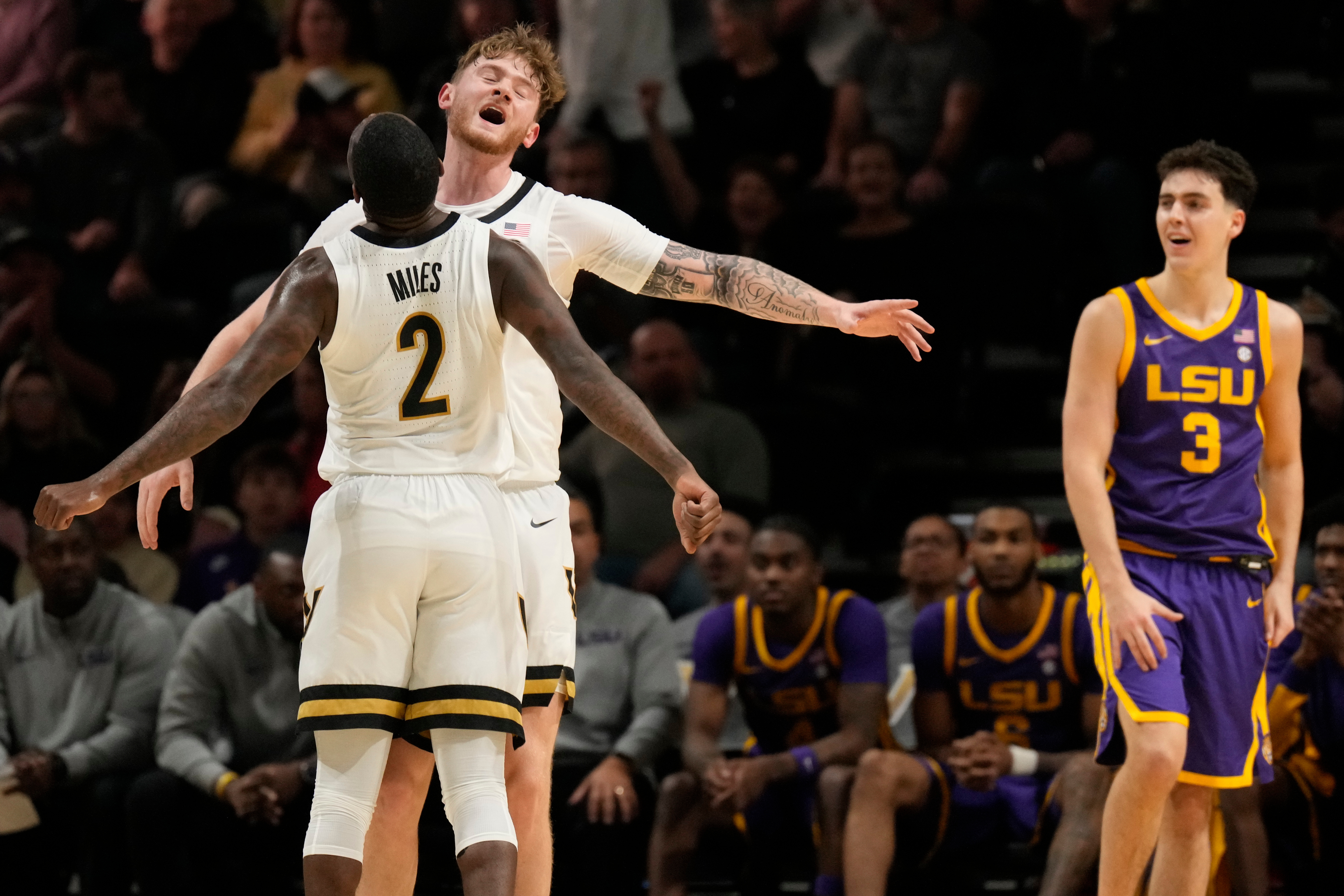 Vanderbilt guard Duke Miles (2) and forward Tyler Nickel, right, celebrate, during the first half of an NCAA college basketball game against LSU, Saturday, Jan. 10, 2026, in Nashville, Tenn.