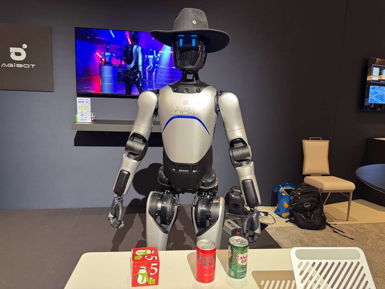 A humanoid robot from robotics company Agibot is on display at Nvidia's booth at CES 2026. Robots like these were part of another AI-dominated CES in Las Vegas.