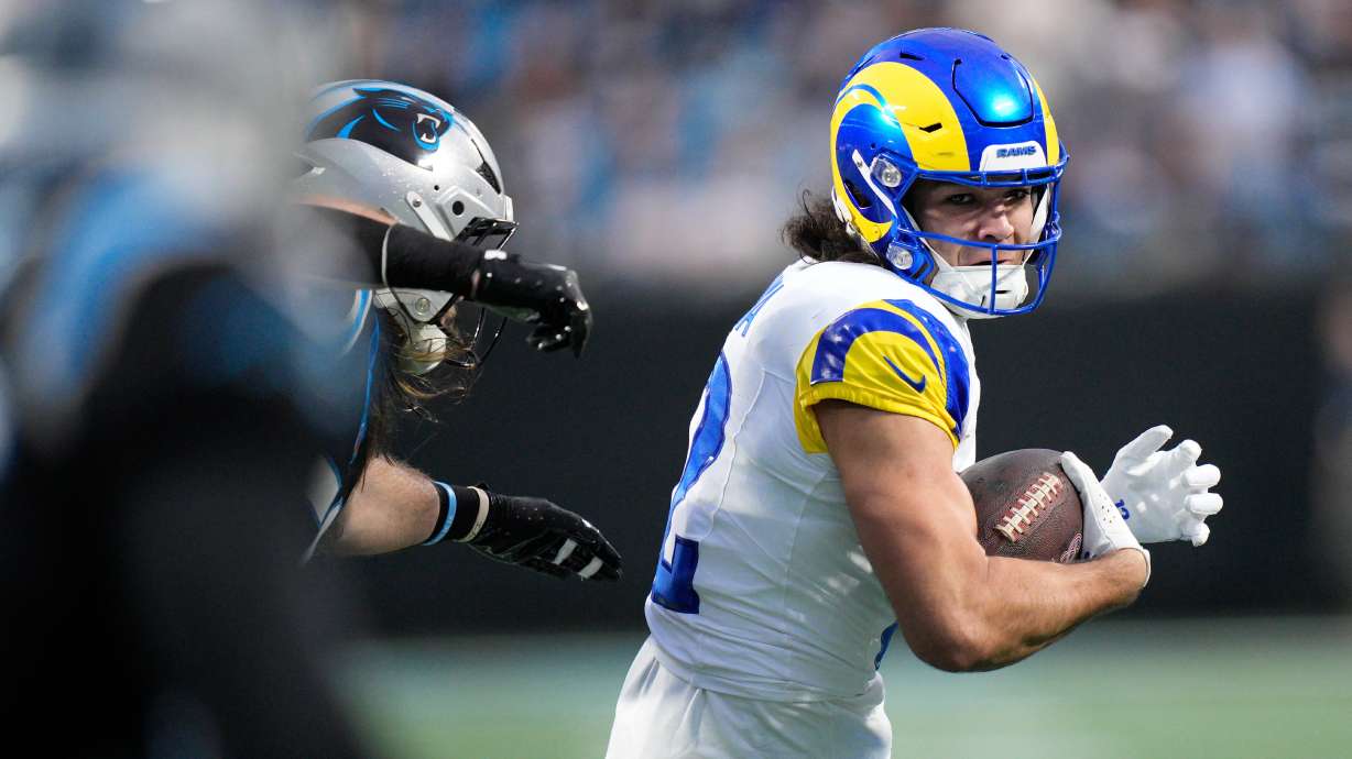 Los Angeles Rams wide receiver Puka Nacua (12) runs after a catch during the first half of an NFL wild-card playoff football game against the Carolina Panthers, Saturday, Jan. 10, 2026, in Charlotte, N.C.
