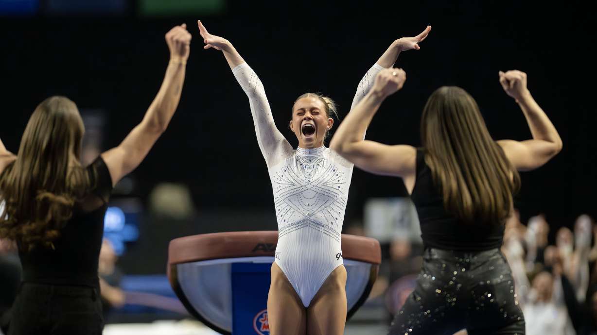 Utah’s Avery Neff celebrates her vault as the RedRocks compete in the Sprouts Collegiate Quad, at the Maverik Center in West Valley City, on Saturday, Jan. 10, 2026. Neff scored a perfect 10 on the vault.