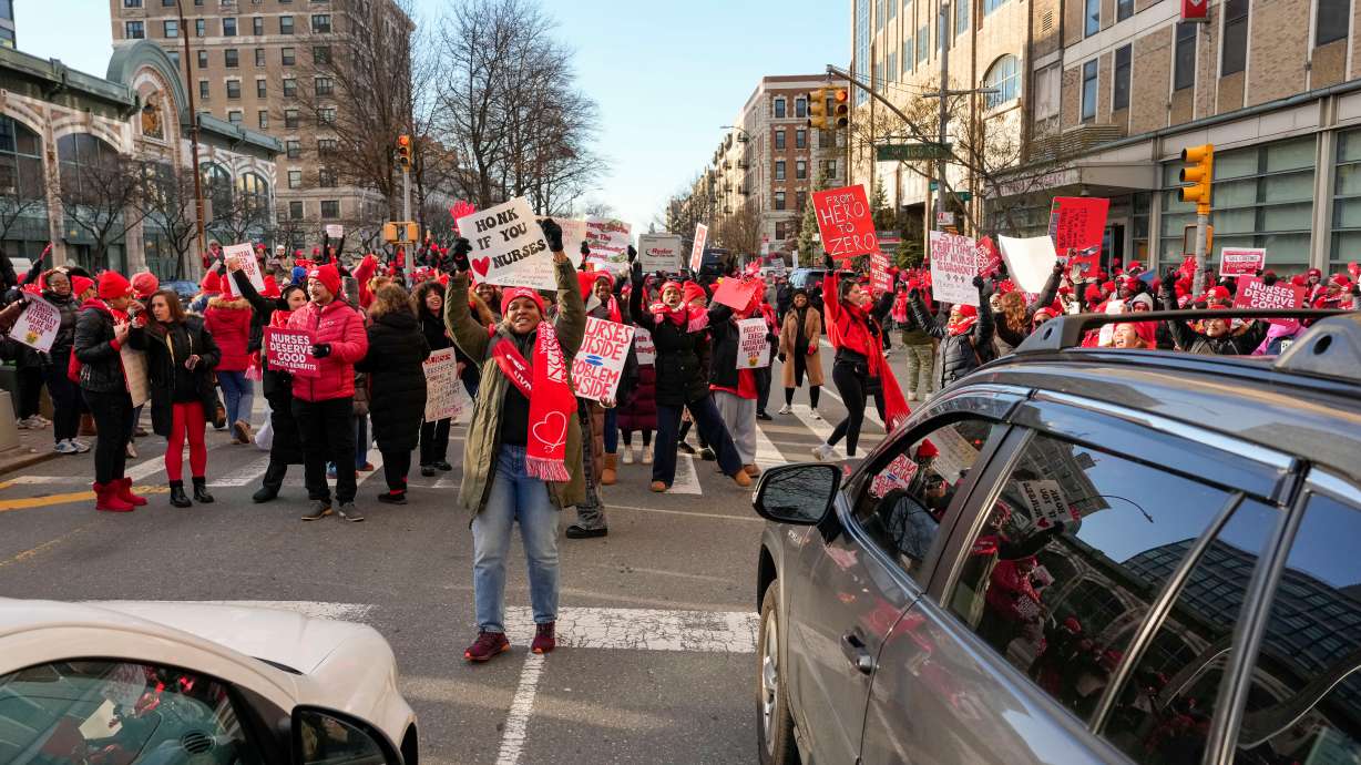 Nurses strike outside New York-Presbyterian Hospital, Monday, in New York.