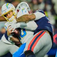 Chargers coach Jim Harbaugh says 'Those that stay will be champions.' QB Justin Herbert isn't sure