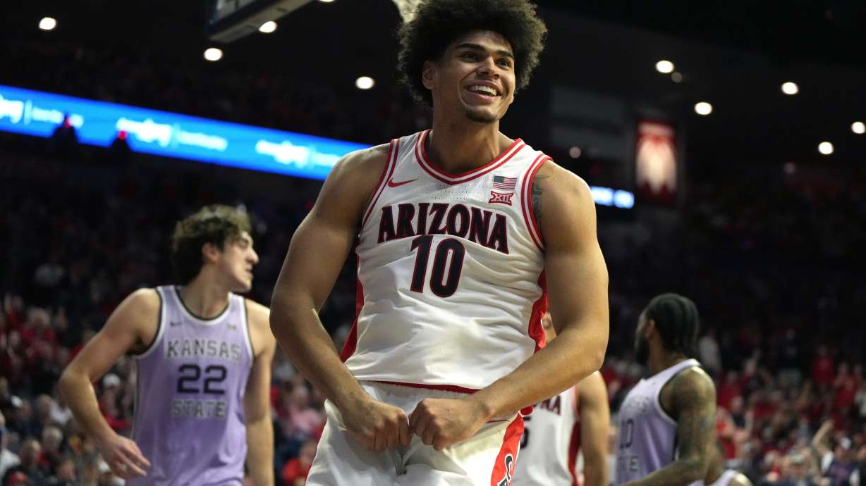 Arizona forward Koa Peat reacts after scoring against Kansas State during the second half of an NCAA college basketball game, Wednesday, Jan. 7, 2026, in Tucson, Ariz.