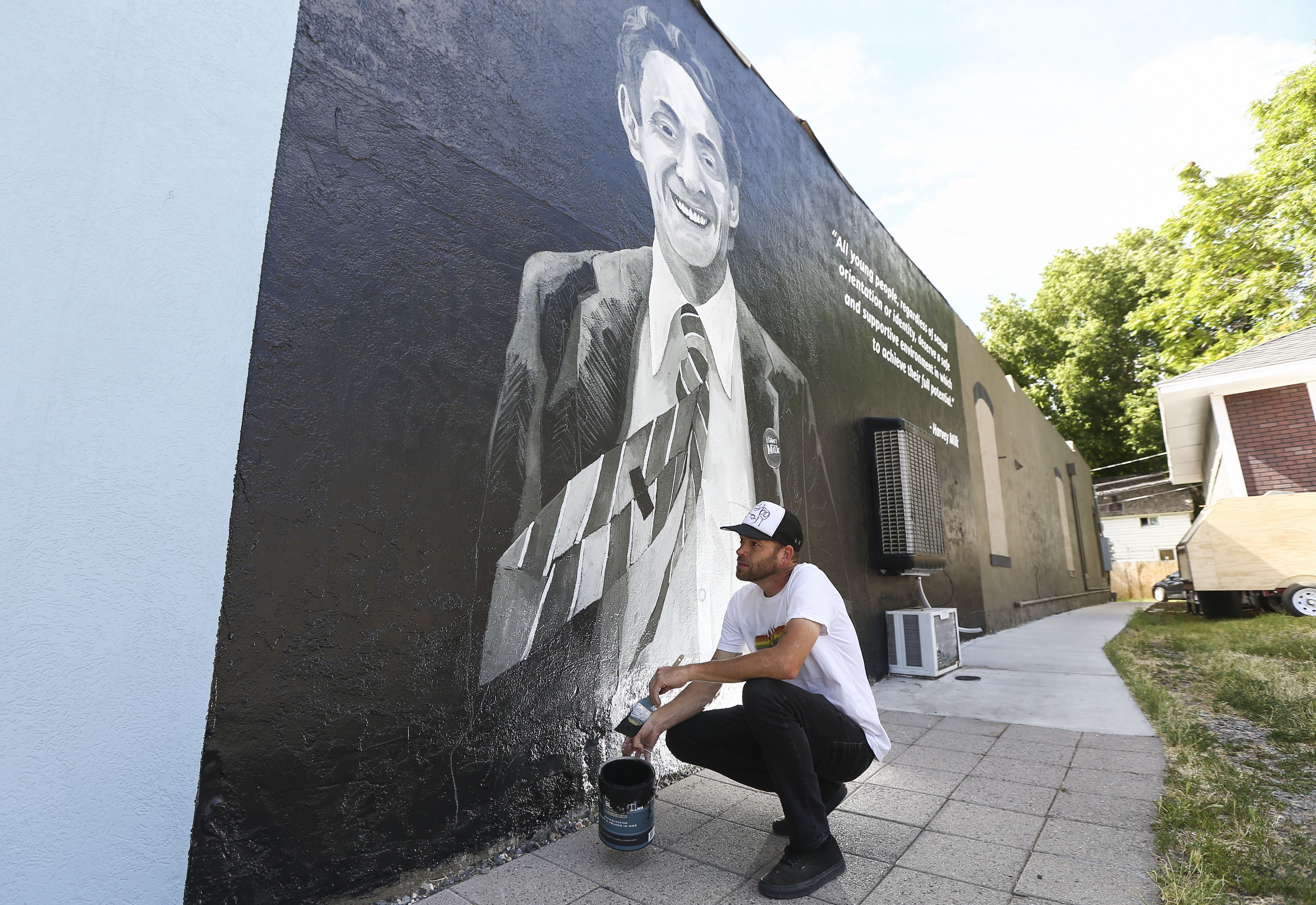Local artist Josh Scheuerman works on a mural in honor of civil and LGBT rights leader Harvey Milk on a building at 265 E. 900 South (Harvey Milk Boulevard) in Salt Lake City on June 27, 2019.