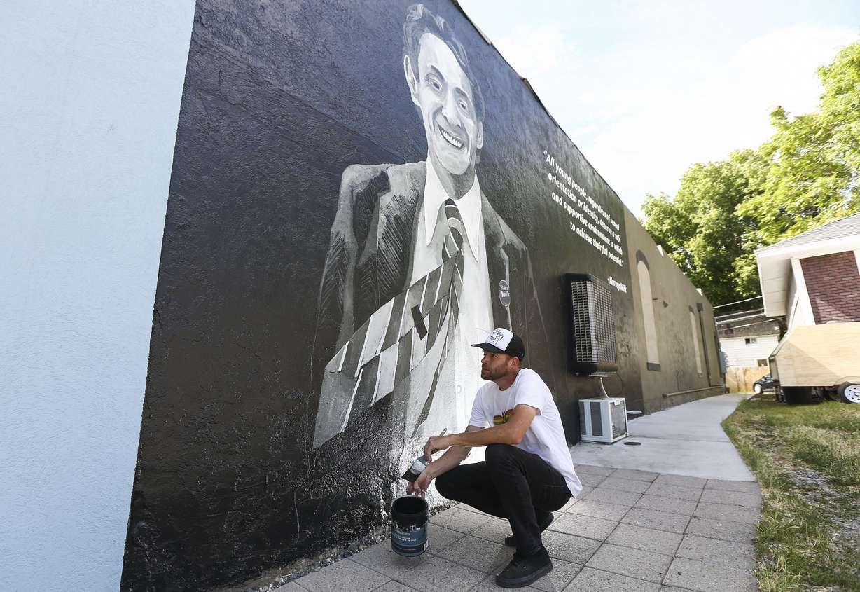 Local artist Josh Scheuerman works on a mural in honor of civil and LGBT rights leader Harvey Milk on a building at 265 E. 900 South (Harvey Milk Boulevard) in Salt Lake City on June 27, 2019.