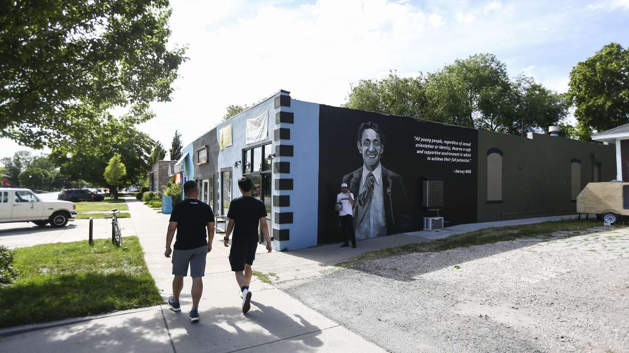 Josh Scheuerman works on a mural in honor of civil and LGBT rights leader Harvey Milk at 265 E. 900 South (Harvey Milk Boulevard) in Salt Lake City on June 27, 2019. A proposed bill seeks to rename the street after Charlie Kirk.