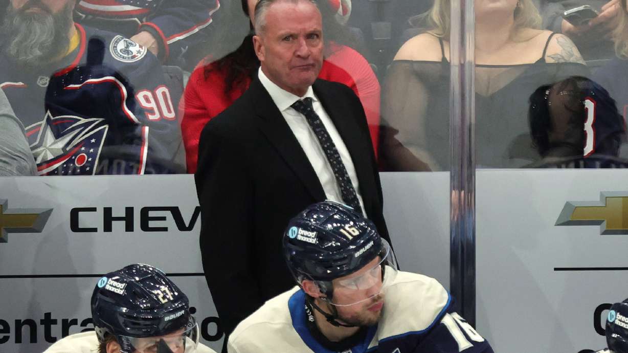 Columbus Blue Jackets coach Dean Evason watches his team during the third period of an NHL hockey game against the New Jersey Devils in Columbus, Ohio, Wednesday, Dec. 31, 2025.