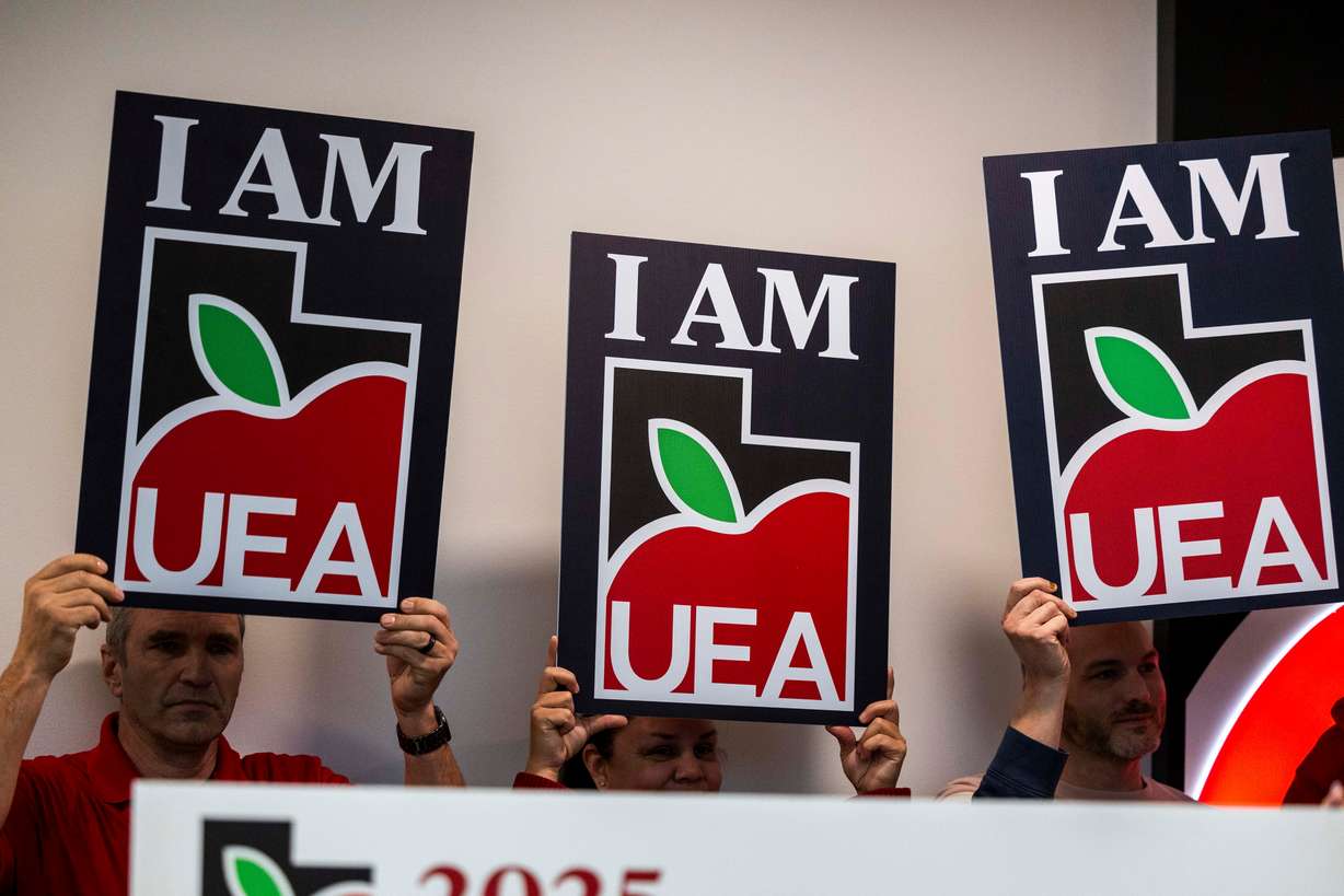 Utah Education Association signs are held up during a press conference at their headquarters in Murray, Jan. 13, 2025. The association is pushing back against a divisive teacher discipline bill that is still sitting on Gov. Spencer Cox's desk as of Tuesday.