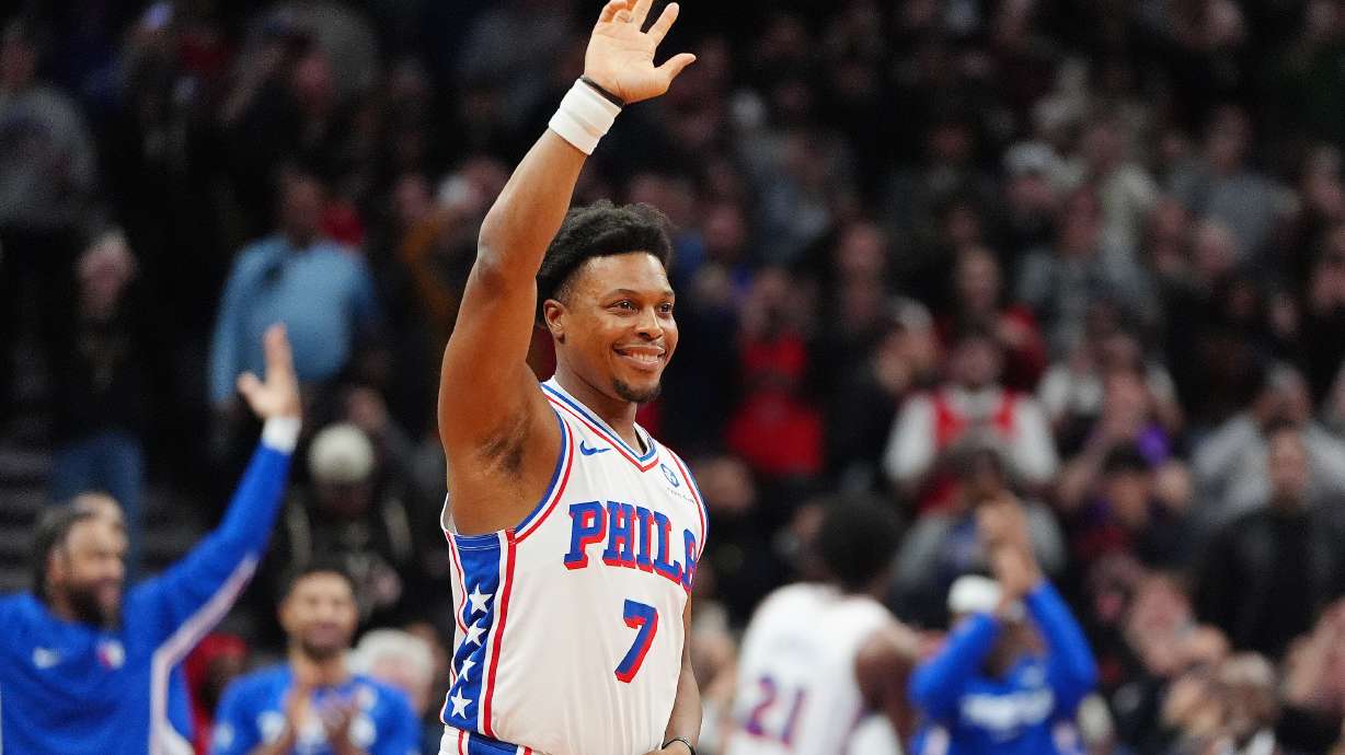 Philadelphia 76ers guard Kyle Lowry (7) acknowledges the fans as he is brought in during the final minutes of an NBA basketball game against his former team, the Toronto Raptors, in Toronto, Monday, Jan. 12, 2026.
