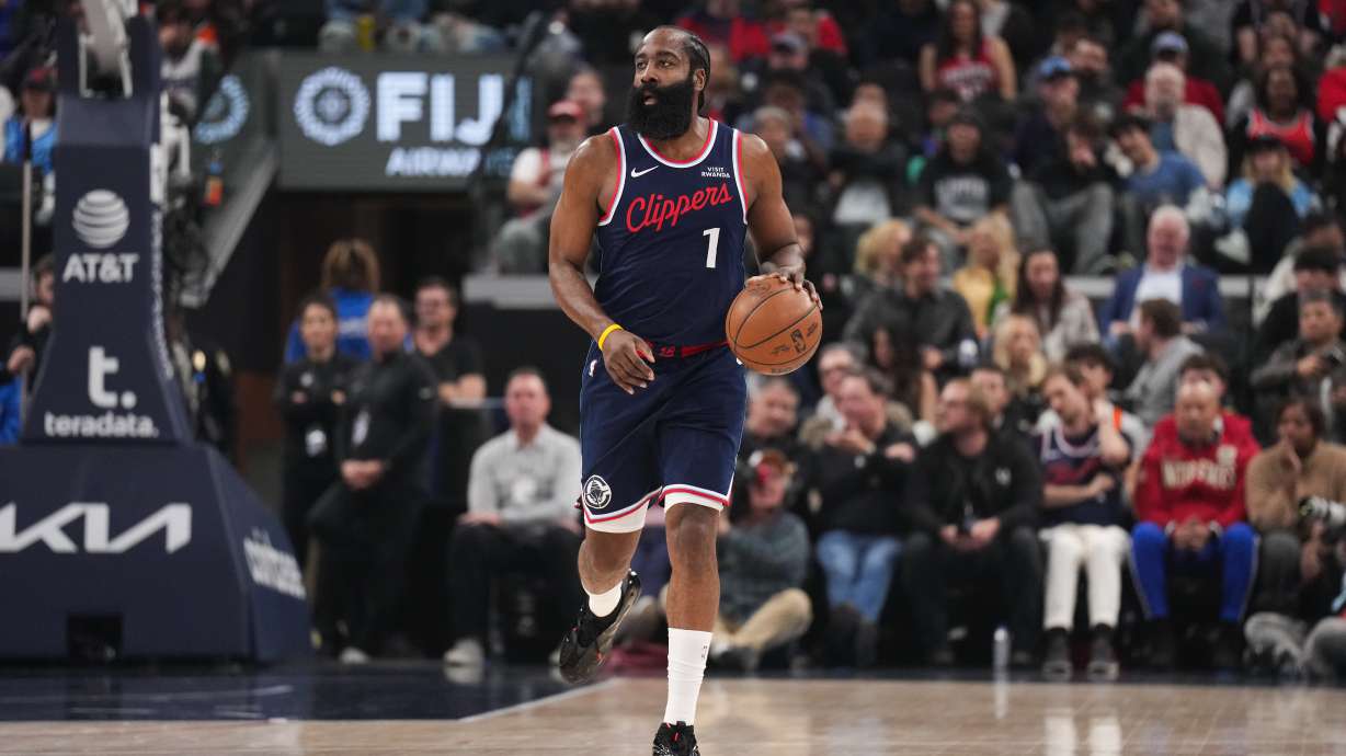 Los Angeles Clippers guard James Harden (1) dribbles during the first half of an NBA basketball game against the Charlotte Hornets Monday, Jan. 12, 2026, in Inglewood, Calif.