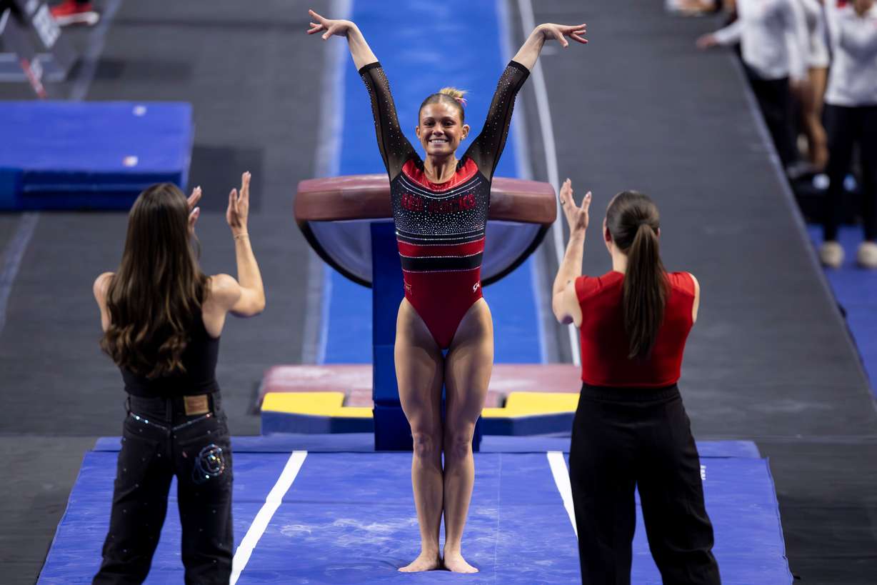 Utah’s Avery Neff salutes after sticking her vault during the “Best of Utah” gymnastics meet at the Maverik Center in West Valley City on Monday, Jan. 12, 2026.