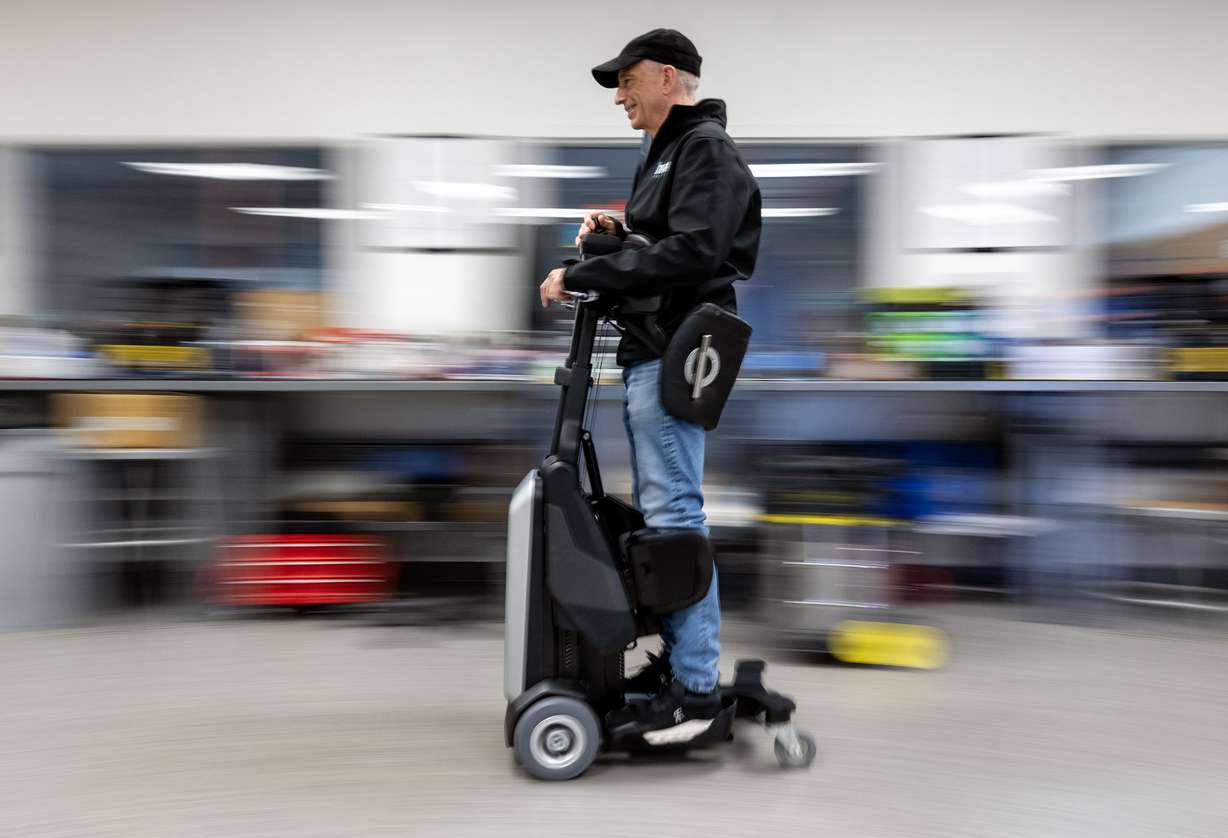 Steven Boal, CEO of Matia Mobility, a manufacturer of robotic standing wheelchairs, demonstrates how the Tek works with one of their units in Salt Lake City on Dec. 30, 2025.