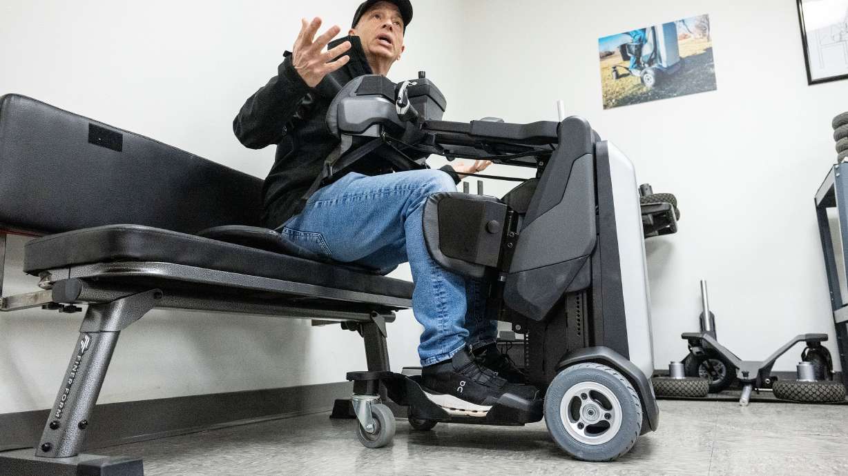 Steven Boal, CEO of Matia Mobility, a manufacturer of robotic standing wheelchairs, demonstrates how the Tek works with one of their units in Salt Lake City on Dec. 30, 2025.