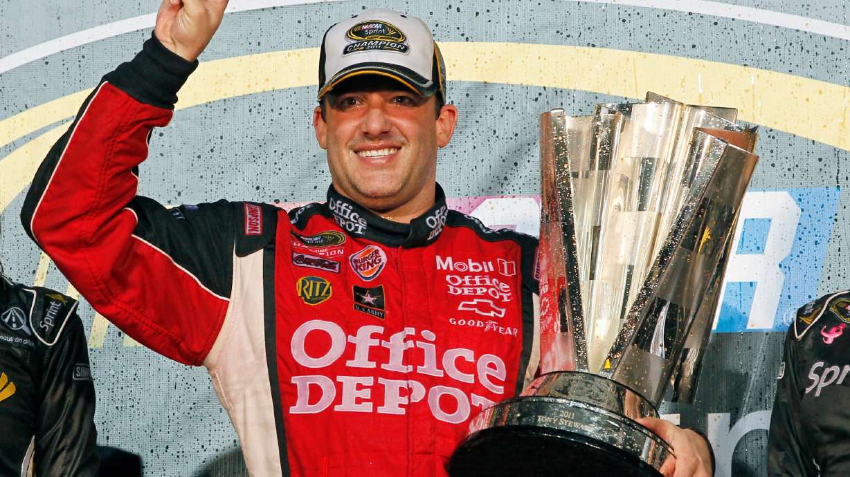 FILE - In this Nov. 20, 2011 file photo, Tony Stewart celebrates after winning his third NASCAR Sprint Cup Series championship, at Homestead-Miami Speedway in Homestead, Fla.
