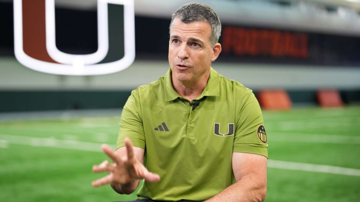 Miami football head coach Mario Cristobal speaks during an interview on the team's indoor practice field in Coral Gables, Fla., Monday, Jan. 12, 2026.