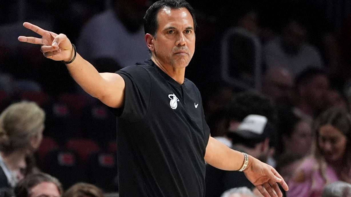 Miami Heat head coach Erik Spoelstra gestures from courtside during the first half of an NBA basketball game against the Phoenix Suns, Tuesday, Jan. 13, 2026, in Miami.