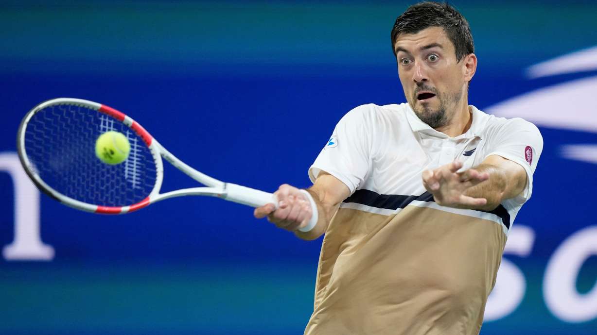 FILE - Sebastian Ofner, of Austria, returns a shot to Casper Ruud, of Norway, during the first round of the U.S. Open tennis championships, Monday, Aug. 25, 2025, in New York.
