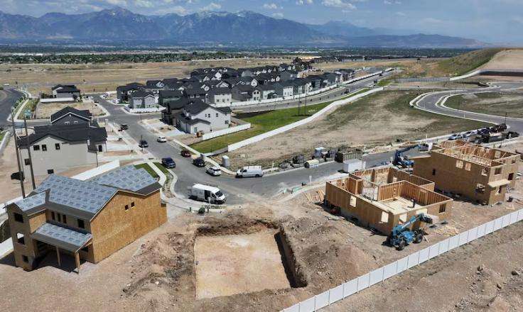 Single-family homes are under construction at Cascade at Sky Ranch by Woodside Homes in West Jordan on June 25, 2025.