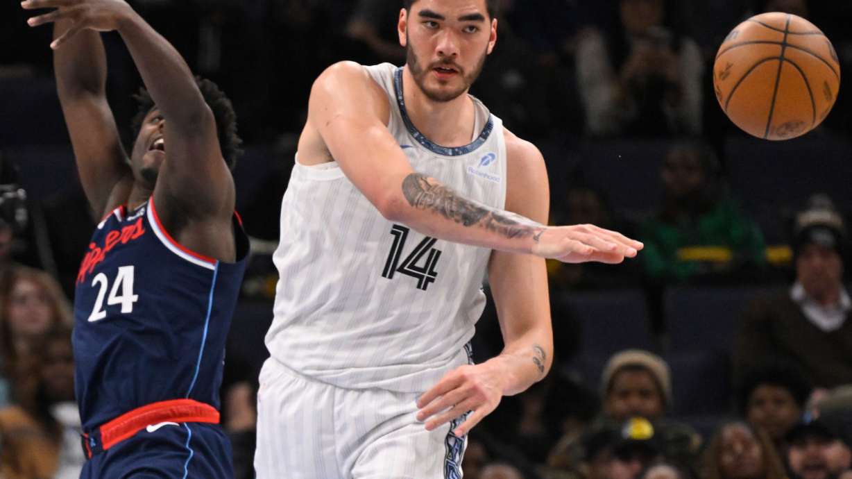 FILE - Memphis Grizzlies center Zach Edey (14) passes away from Los Angeles Clippers forward Kobe Brown (24) during an NBA basketball game Friday, Dec. 5, 2025, in Memphis, Tenn.