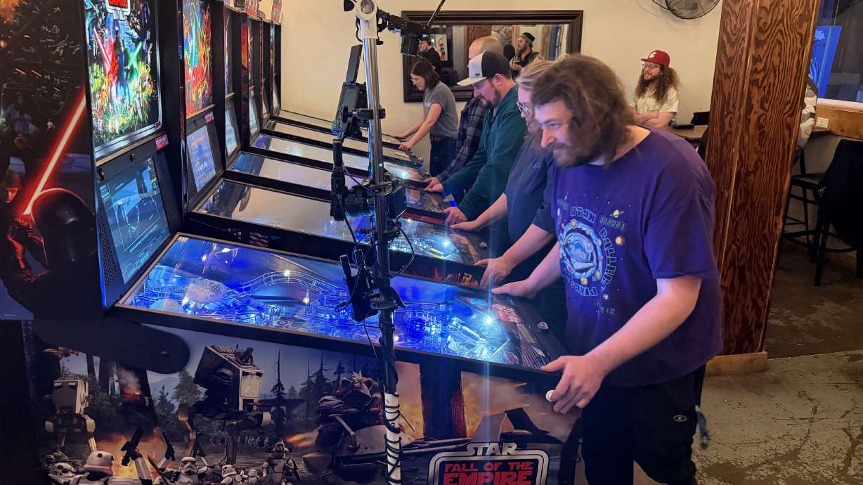 Pinball players compete in a tournament at Kiitos Brewing, 608 W. 700 South, on Tuesday. Tuesday's tournament was the final one before Saturday's Utah State Pinball Championship.