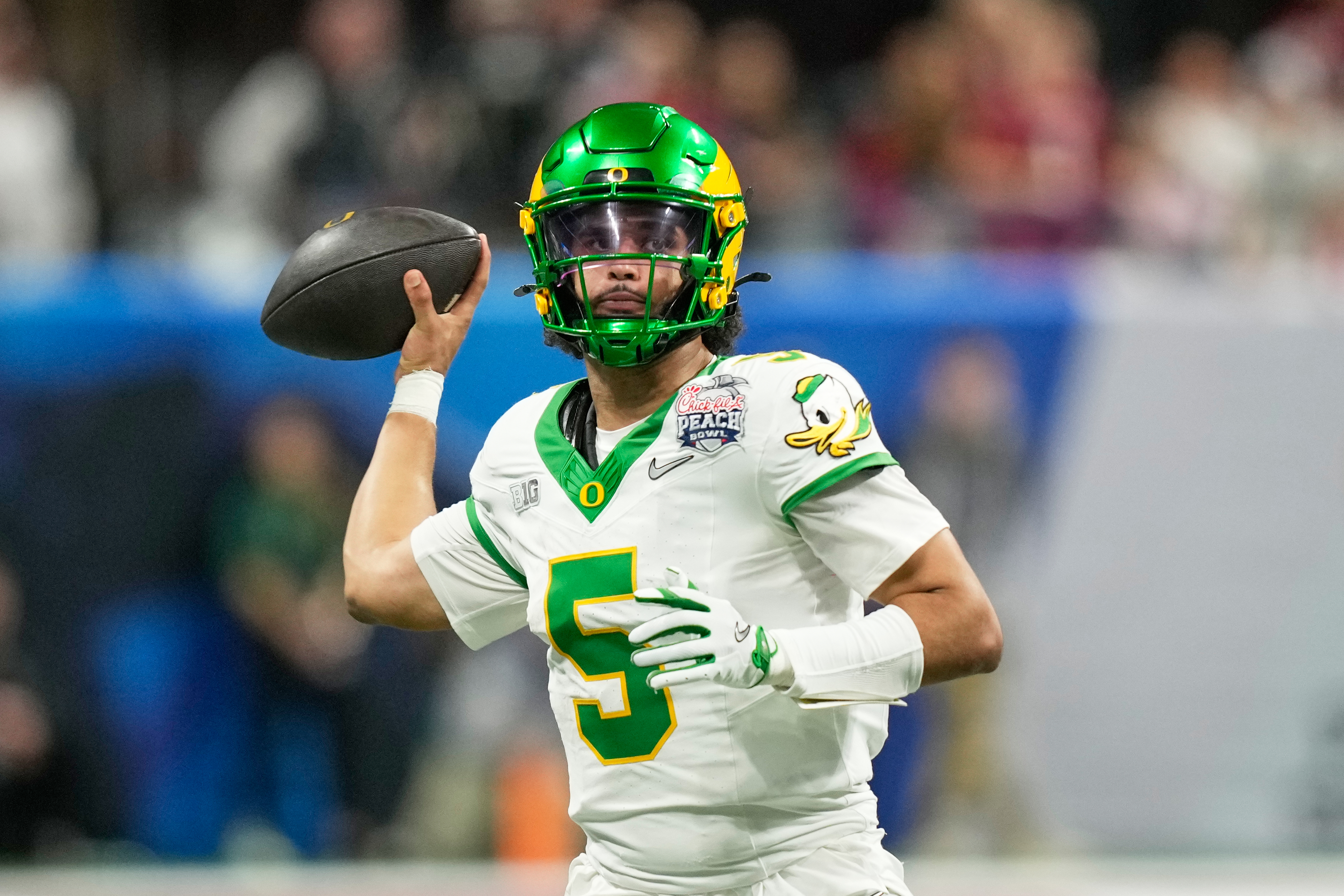 Oregon quarterback Dante Moore (5) passes against Indiana during the second half of the Peach Bowl NCAA college football playoff semifinal, Friday, Jan. 9, 2026, in Atlanta.