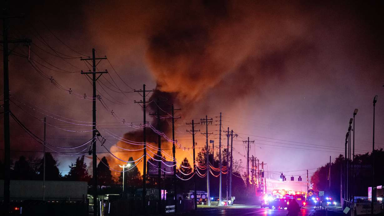 Plumes of smoke rise after a UPS cargo plane crash at Louisville Muhammad Ali International Airport, on Nov. 4, in Louisville, Ky. Boeing had warned plane owners in 2011 about a broken part that contributed to the crash that killed 15 last year.