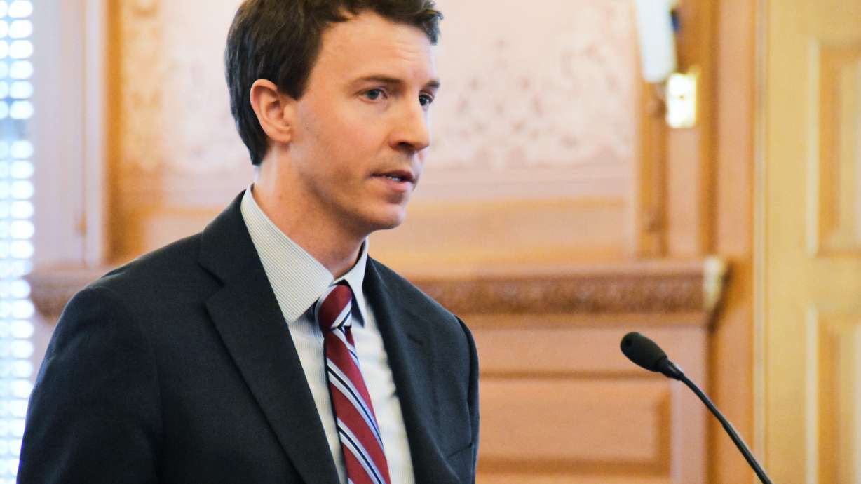 FILE - Bryan Seeley, a Major League Baseball senior vice president, testifies on a bill during a legislative committee hearing, March 13, 2018, at the Statehouse in Topeka, Kan.