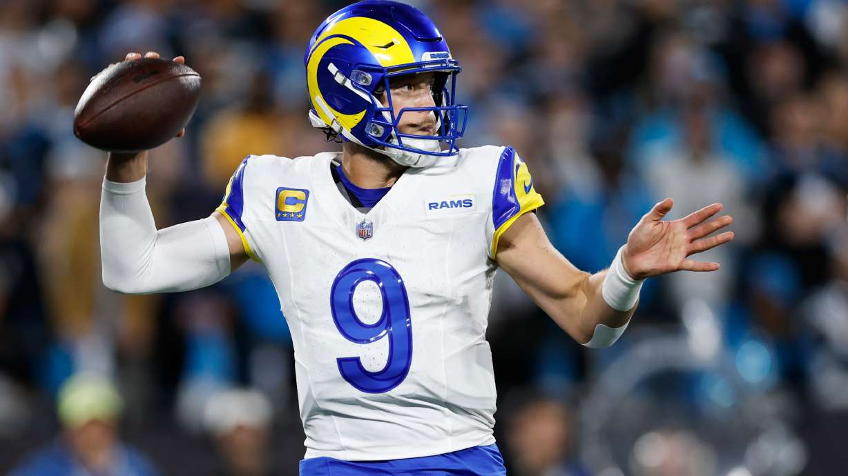 Los Angeles Rams quarterback Matthew Stafford (9) throws a pass during the second half of an NFL wild-card playoff football game against the Carolina Panthers, Saturday, Jan. 10, 2026, in Charlotte, N.C.