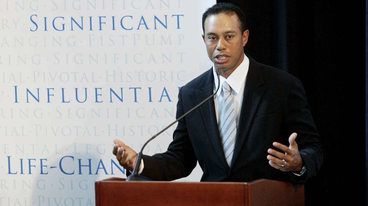 FILE - Golfer Tiger Woods announces the launch of a nationwide youth program called the "Fist Pump Challenge" in Anaheim, Calif., Jan. 21, 2008.