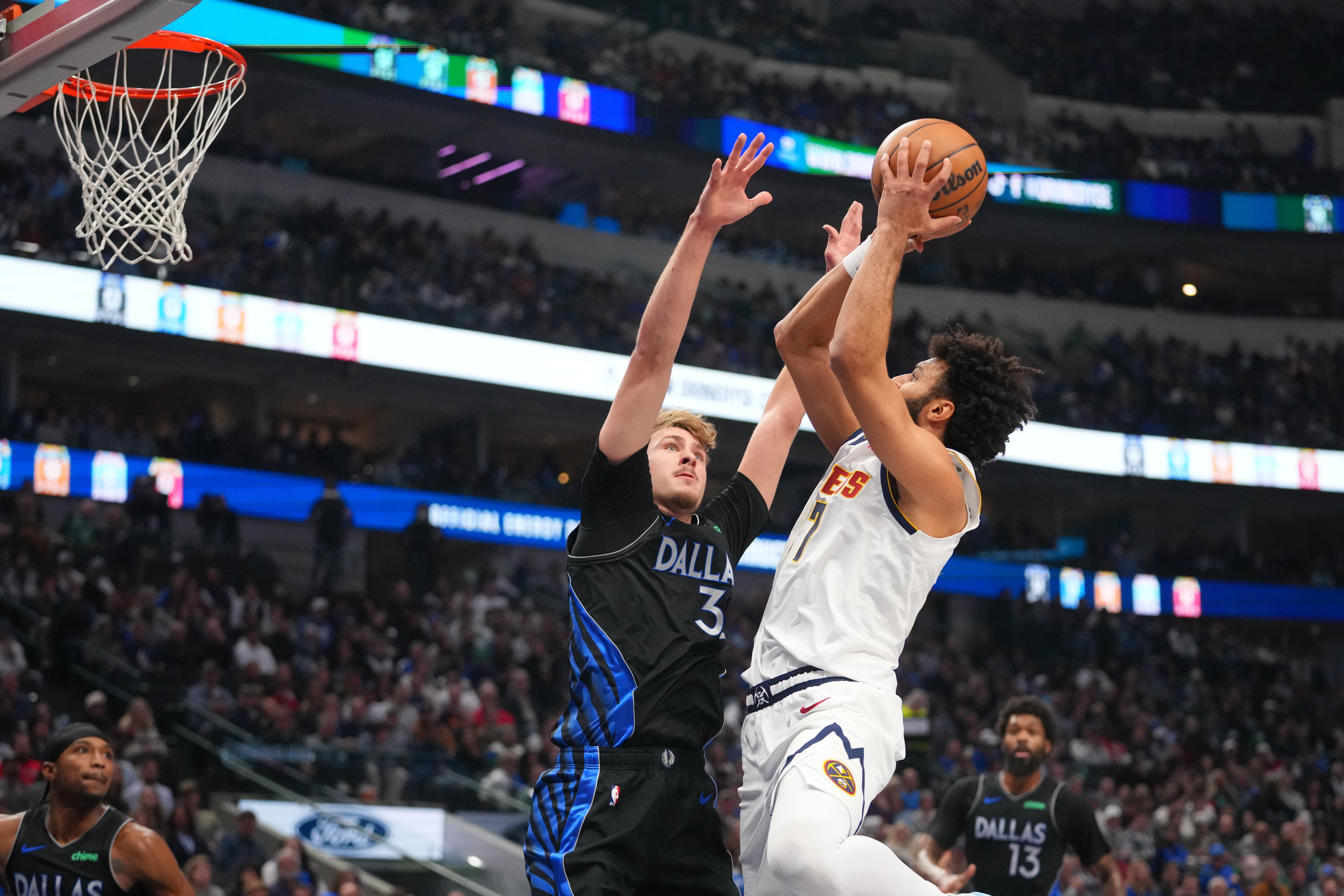 Cooper Flagg sprains an ankle and is ruled out after halftime for Mavs against Nuggets